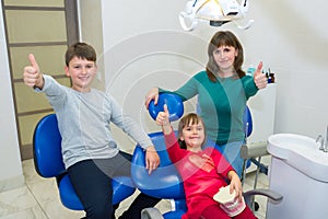 A happy family in a dentistÃ¢â¬â¢s office photo